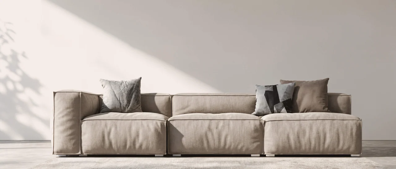 A front elevation study of a modular sofa in angled daylight